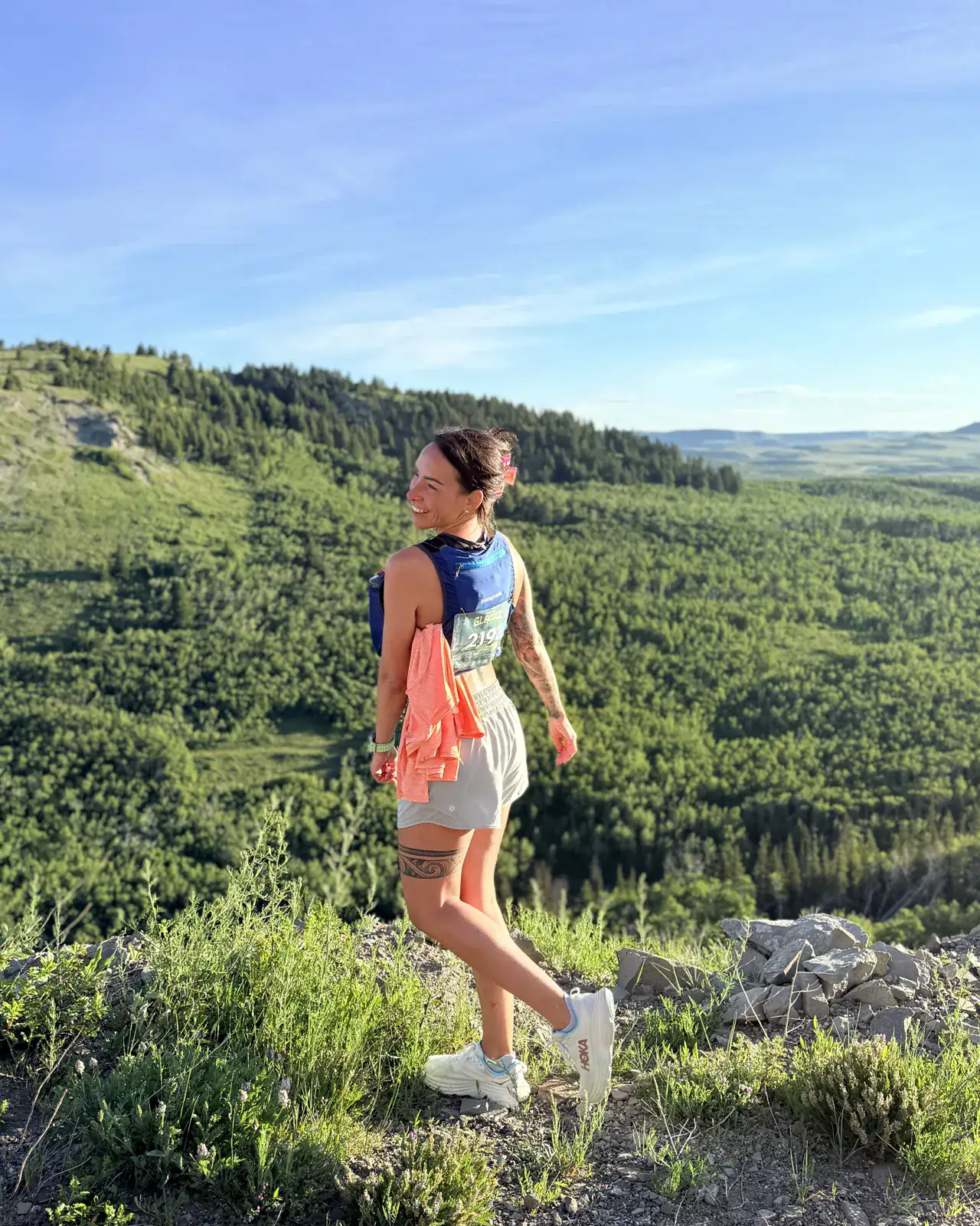 Clare Bourdon out running on a Montana ridgeline on a clear summer evening.
